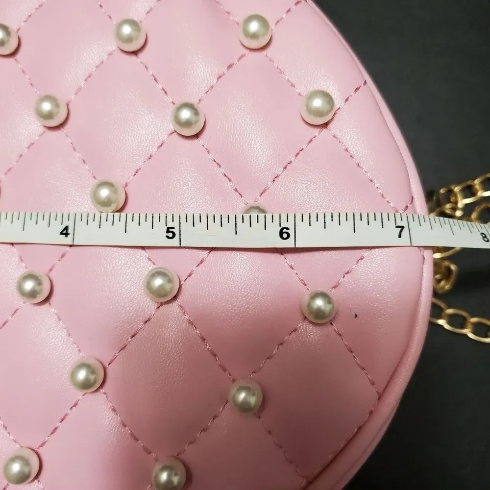 Round pink crossbody with faux pearls